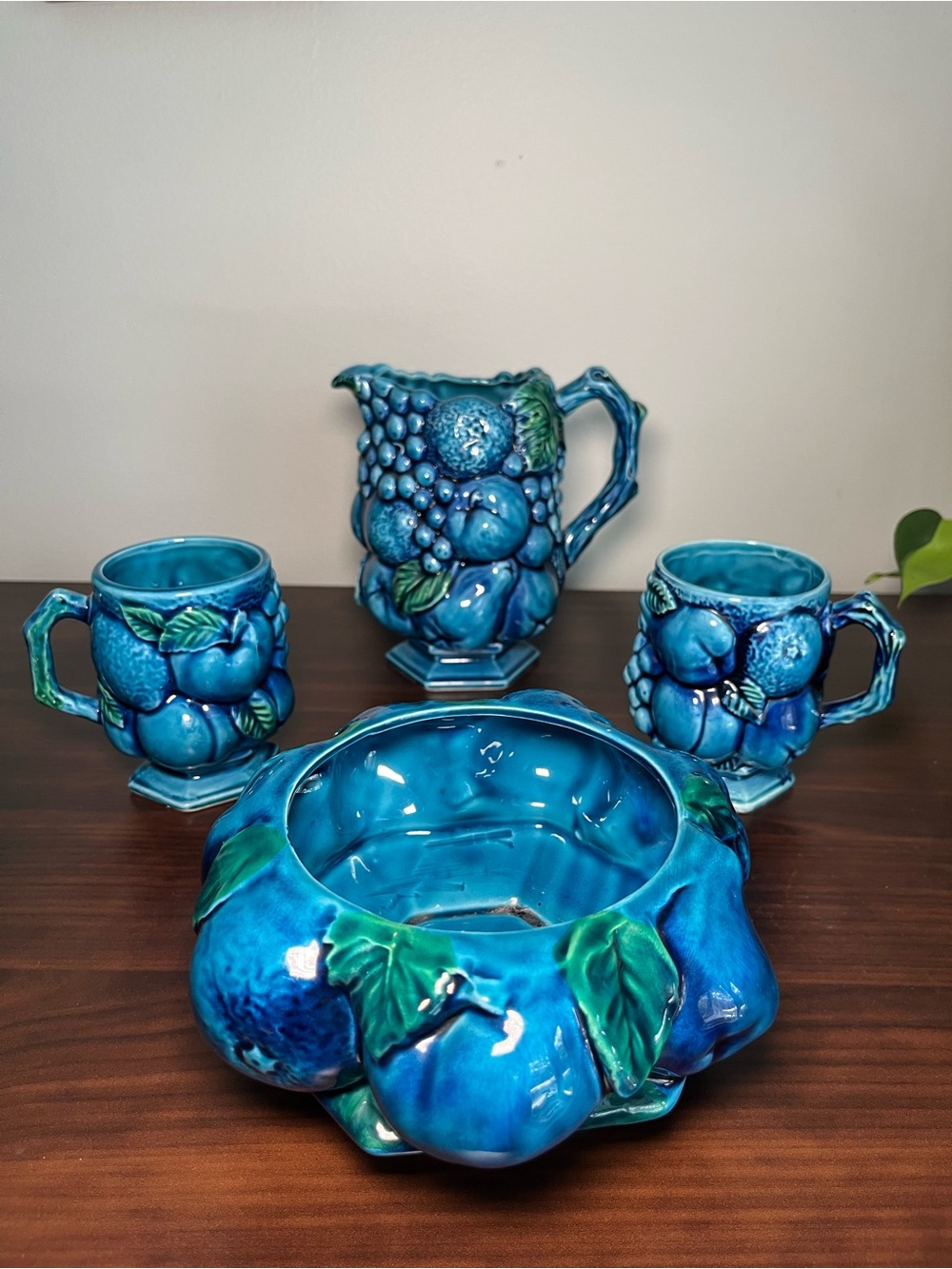 Vintage Inarco indigo blue ceramic fruit-themed mugs, pitcher, 2 mugs and bowl.